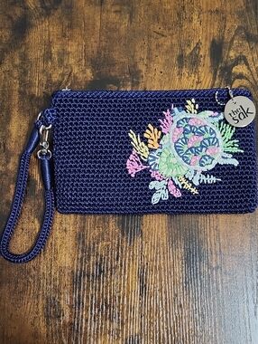 The Sak Navy Crochet Wristlet with Silver Logo Charm, NWT